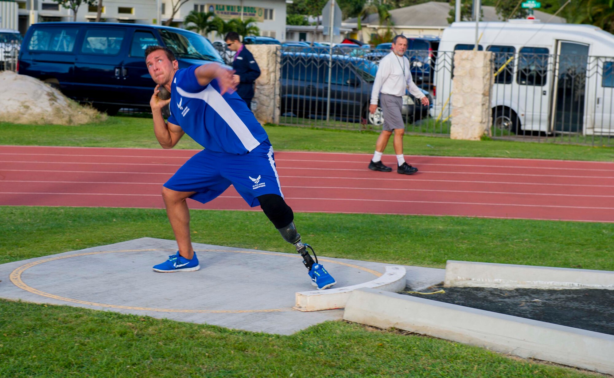 Retired Senior Airman Gideon Connelly throws a shot put during the track and field competition of the inaugural Wounded Warrior Pacific Invitational in Honolulu, Hawaii, Jan. 8, 2014. The WWPI is one in a series of adaptive athletic events leading up to the 2014 Warrior Games, an annual competition among wounded warriors from all branches of military service. (U.S. Air Force photo/Tech. Sgt. Terri Paden)
