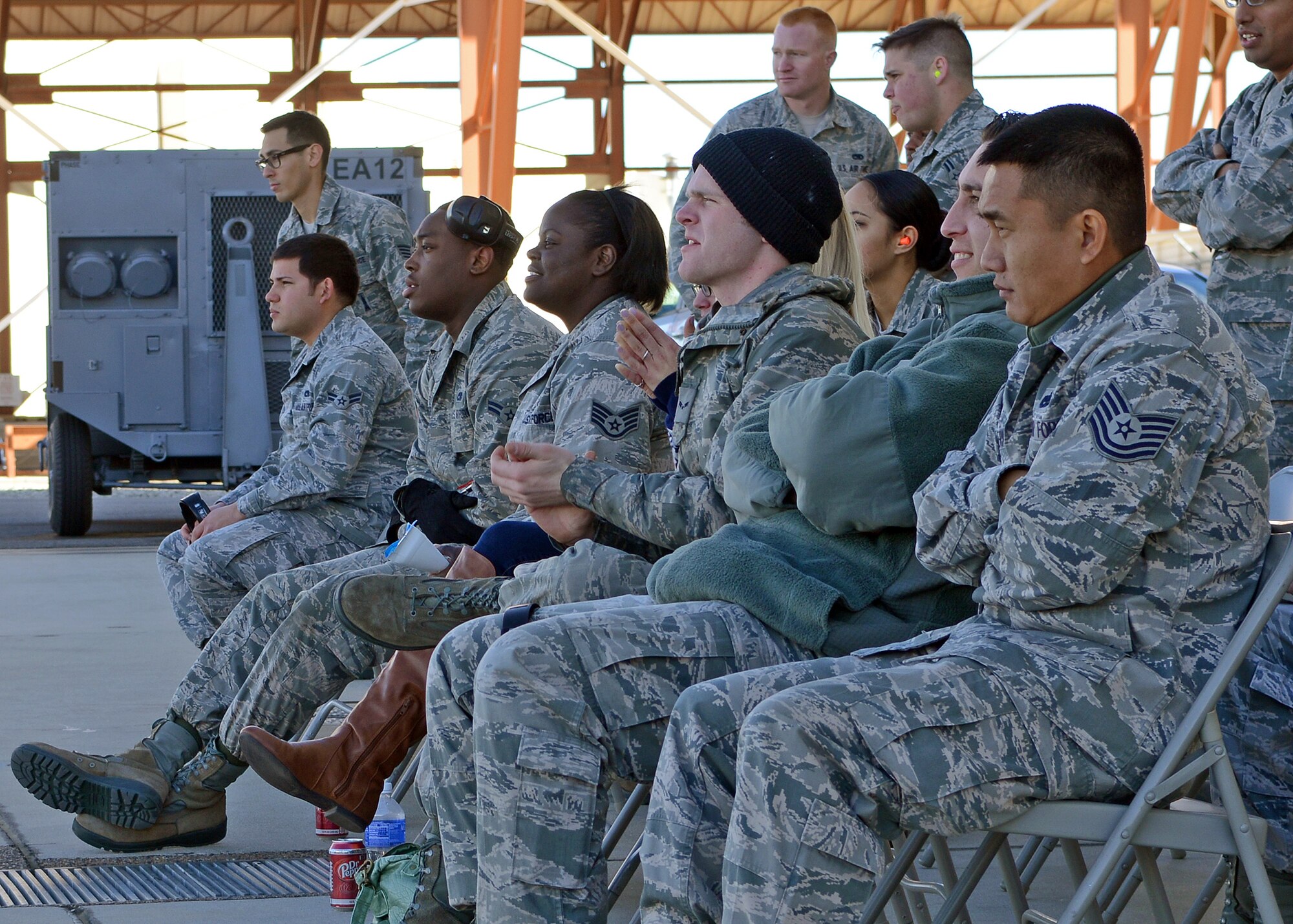 Weapons load crew members with the 445th Aircraft Maintenance Unit cheer on fellow team members loading an F-16 Falcon during the Fourth Quarter Fighter Weapons Load Competition Jan. 6, 2014. Weapons load crew members from the 445th, 411th FLTS and 461st AMU competed in the friendly competition to showcase each crew member’s talent. The 445th AMU claimed this quarter's trophy and all of the quarterly winners will compete for the Load Crew of the Year Competition trophy which will take place Feb. 3, 2014. (U.S. Air Force photo by Jet Fabara)