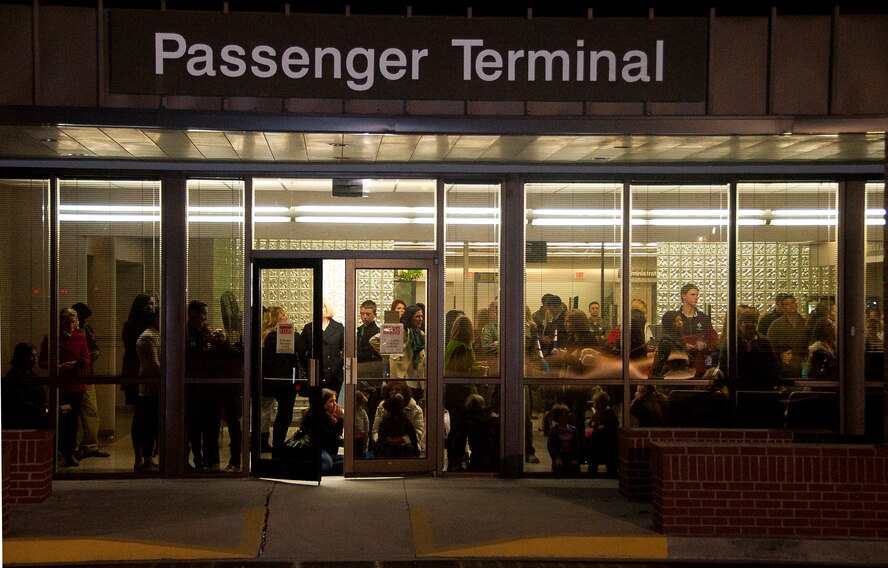 15th Airlift Squadron friends and family wait for their loved ones at the Passenger Terminal,  Jan. 6, 2014, at Joint Base Charleston — Air Base, S.C. More than 80 Airmen from the 15th AS returned from a 60-day deployment to Southwest Asia. (U.S. Air Force photo/Staff Sgt. William O’Brien)