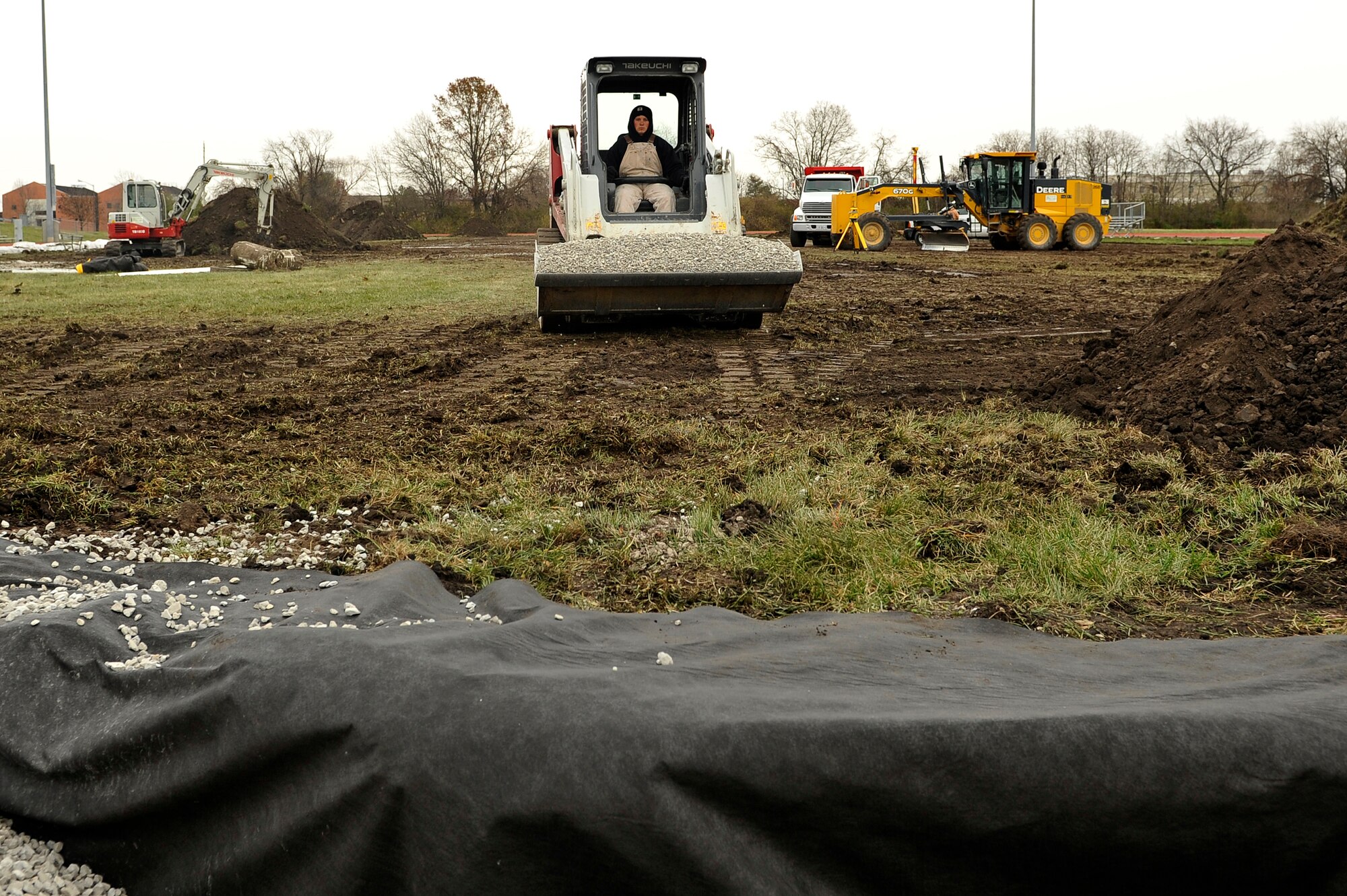 Renovations begin at the James Gym track Nov.25 at Scott Air Force Base, Ill. AstroTurf, a synthetic turf, is being placed on the inside of the track. The track is expected to be avaliable Mar. 1, 2014.  (U.S. Air Force photo/Airman 1st Class Jaeda Waffer)