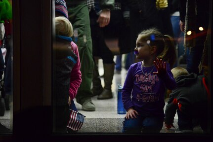 Brynlee, daughter of Tech. Sgt. Thomas Zahner, 15th Airlift Squadron loadmaster, waits for her father Jan. 6, 2014, at Joint Base Charleston — Air Base, S.C.  More than 80 Airmen from the 15th AS returned from a 60-day deployment to Southwest Asia.  (U.S. Air Force photo/Airman 1st Class Clayton Cupit)