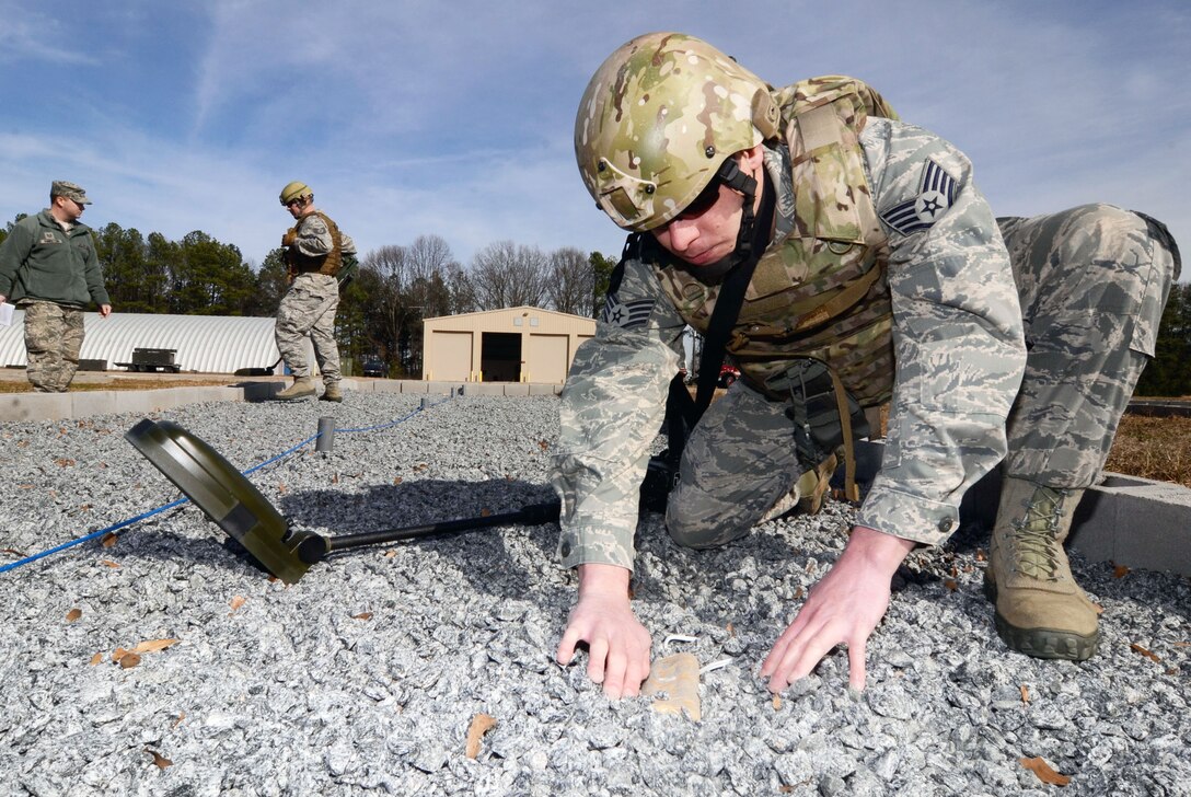Reservists from the Explosive Ordinance Disposal Flight, 94th Civil Engineer Squadron, train on the Minehound VMR2 Ground Penetrating Radar (GPR) metal detector in a simulated minefield, during an exercise at the Air Force Reserve Command Expeditionary Combat Support Training Certification Center here, Jan. 24. (U.S. Air Force photo/Don Peek)