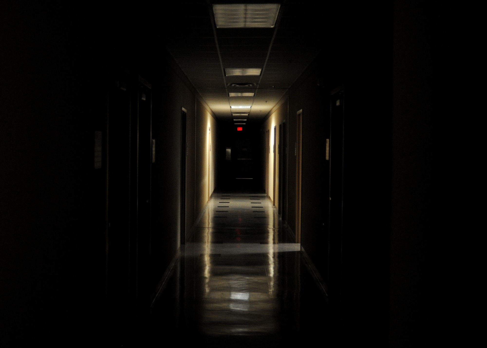 ALTUS AIR FORCE BASE, Okla. – The KC-135 Stratotanker training building is dark besides room OFT-12, where French air force Capt. Aurélien Leray studies alongside U.S. Air Force Maj. Kris Person on flying the KC-135 Nov. 8, 2013. The pilots began their training at 2:30 a.m. to prepare for an upcoming simulator flight. (U.S. Air Force photo by Senior Airman Levin Boland/Released) 