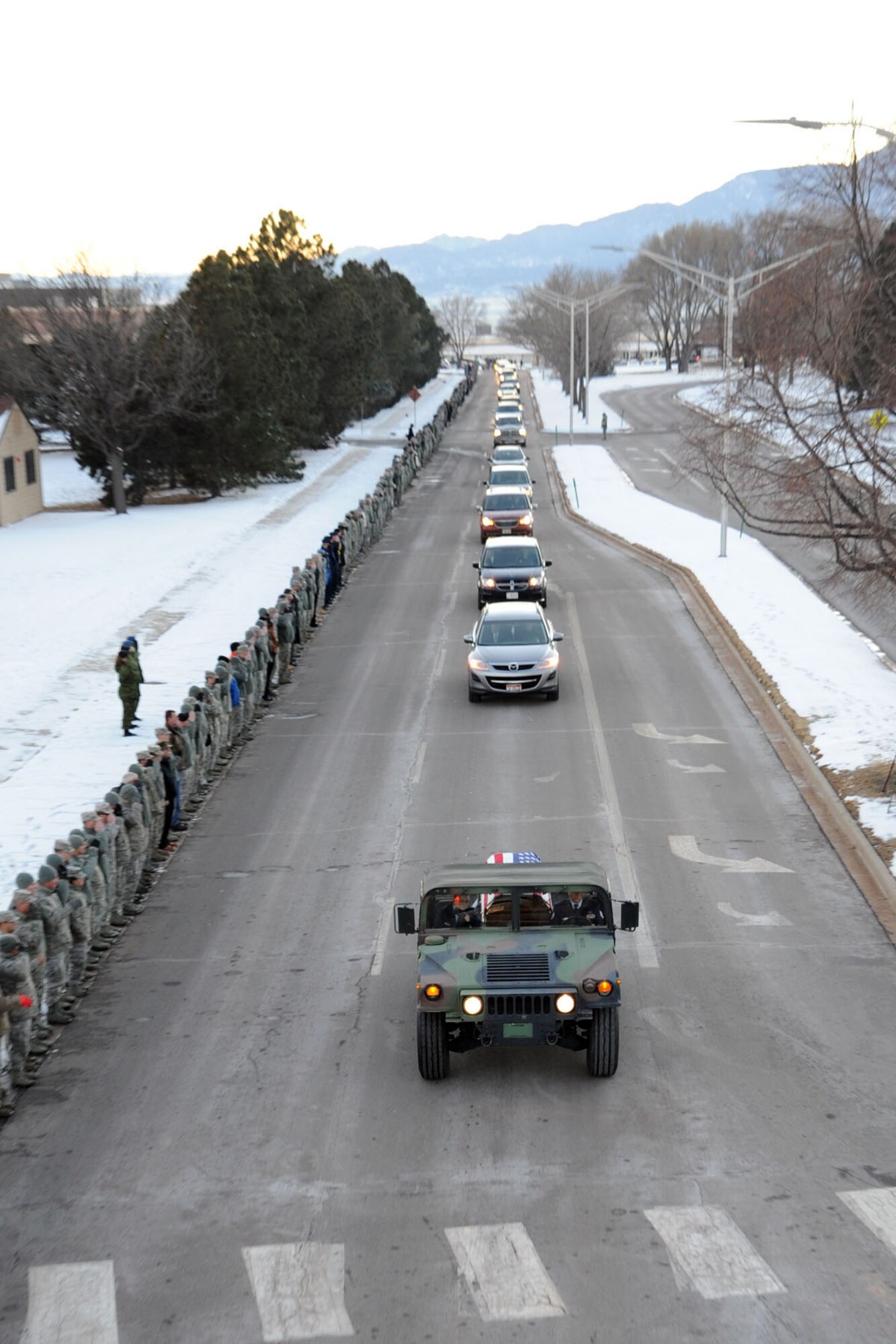 PETERSON AIR FORCE BASE, Colo. – Capt. David Lyon, 21st Logistics Readiness Squadron, was killed in action Dec. 27 when the enemy attacked his convoy in Afghanistan. Lyon was working with Combined Joint Special Operations Task Force – Afghanistan, performing a Combat Advisory mission with Afghan National Army Commandos. Members of Team Pete lined the streets to honor Lyon Jan. 6 as he departed Peterson Air Force Base for the final time. (U.S. Air Force photo/Staff Sgt. J. Aaron Breeden)