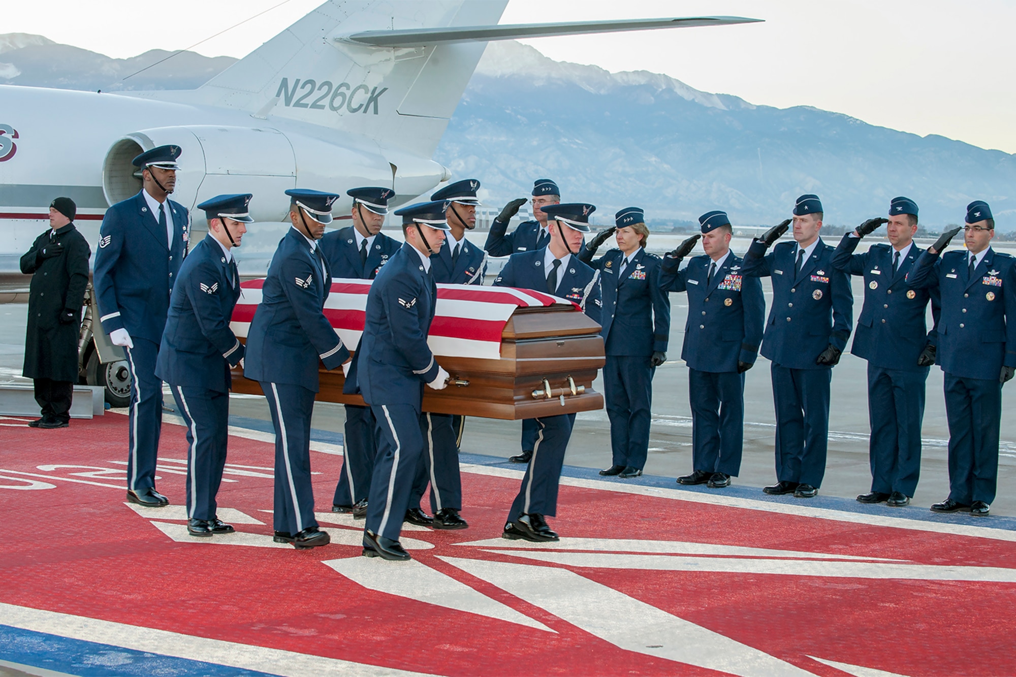 PETERSON AIR FORCE BASE, Colo. – The High Frontier Honor Guard carries the flag-draped coffin of Capt. David I. Lyon Jan. 6 at the Peterson flight line. Lyon, a member of the 21st Logistics Readiness Squadron, was killed Dec. 27 in Afghanistan. (U.S. Air Force photo/Craig Denton)