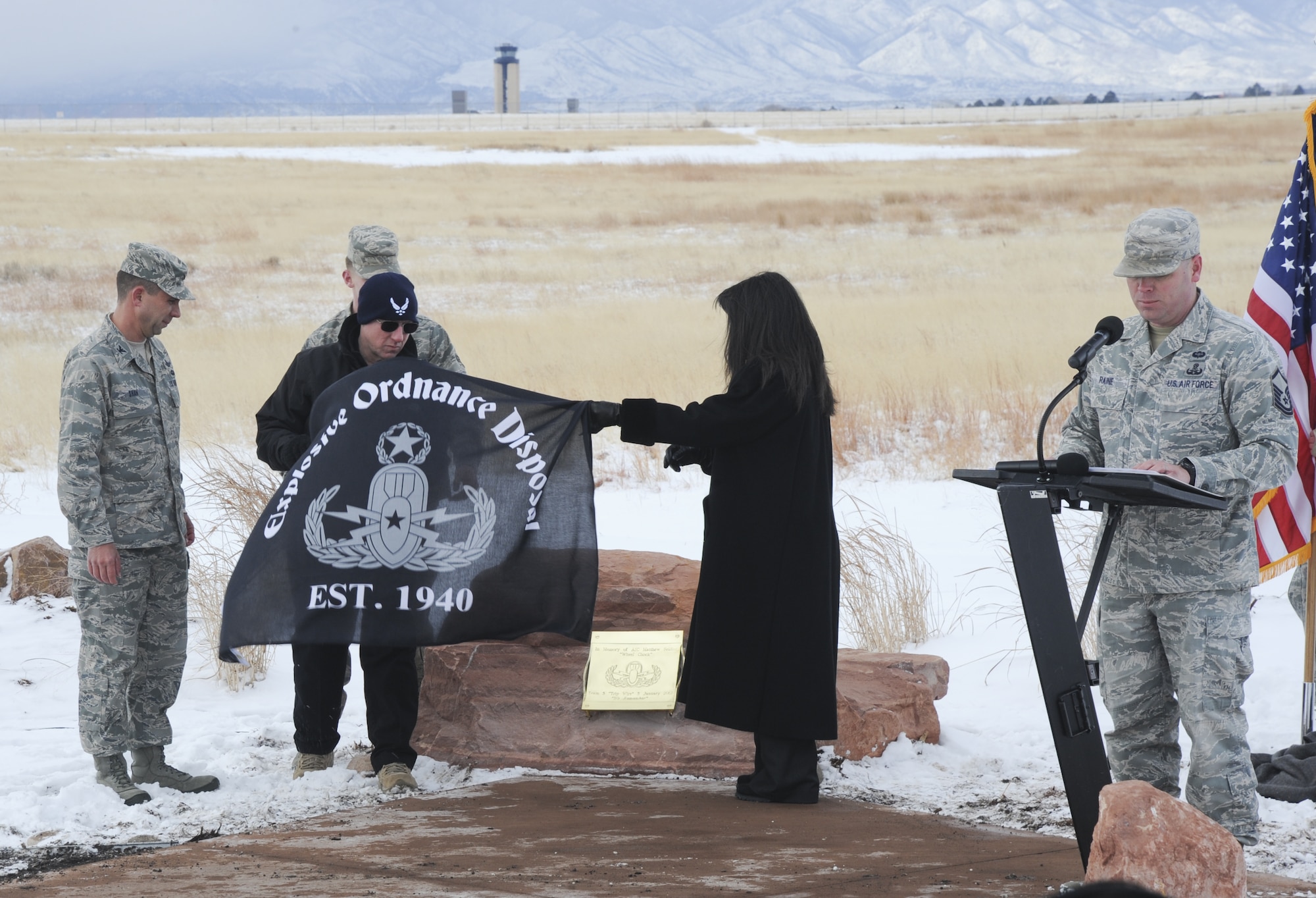 PETERSON AIR FORCE BASE, Colo. – Marc and Lauren Seidler, Airman 1st Class Matthew Seidler’s parents, remove an explosive ordnance disposal banner unveiling a memorial in their son’s honor Jan. 5. Matthew Seidler was killed by an improvised explosive device Jan. 5, 2012, while deployed to Helmand province, Afghanistan, performing route clearance while attached to an Army platoon. (U.S. Air Force photo/Staff Sgt. Jacob Morgan)