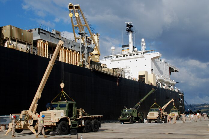 SOUDA BAY, Greece (Sept. 28, 2009) – Marines and sailors of participating units offload and equip MTVRs alongside the USNS 2ndLt. John C. Bobo here as part of Maritime Pre-positioning Force (MPF) Offload 2009.  The exercise is conducted by U.S. Marine Corps Forces Europe in order to test and refine the logistics of providing a robust forward presence in its area of operations.