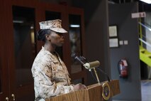 Maj. Melanie R. Bell-Carter, of Cleveland Miss., gives her parting remarks as the commanding officer of Headquarters Company, United States Marine Corps Forces Central Command (Forward).  Bell-Carter was replaced by Maj. Sally A. Falco, a Detroit native, Aug. 15 in a change of a command ceremony.  