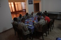 Senior staff noncommissioned officers from U.S. Marine Corps Forces Central Command (Forward) enjoy a traditional Jordanian meal with members of the Royal Jordanian Armed Forces aboard the Royal Jordanian Naval Base, Aqaba, Jordan, June 12, 2013. The dinner was part of Exercise Eager Lion 2013.