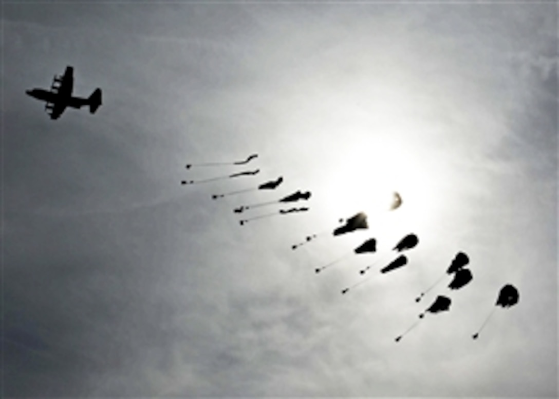 A C-130 Hercules airdrops supplies for coalition forces in the Sayed Abad district in Afghanistan's Wardak province, Jan. 7, 2014. 