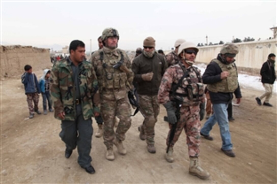 U.S. soldiers and Jordanian forces walk together after a meeting with elders from a village near Bagram Airfield in Afghanistan's Parwan province, Jan, 7, 2014. U.S. forces meet with Afghan elders to build a better relationship with the people who live outside the base. Brooks is assigned to the 1st Cavalry Division's 3rd Battalion, 82nd Field Artillery Regiment, 2nd Brigade Combat Team.  