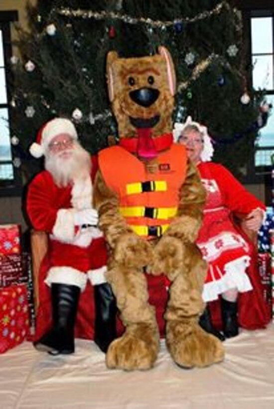 Bobber the Water Safety Dog posses with Santa and Mrs. Claus at Lake Shelbyville. 