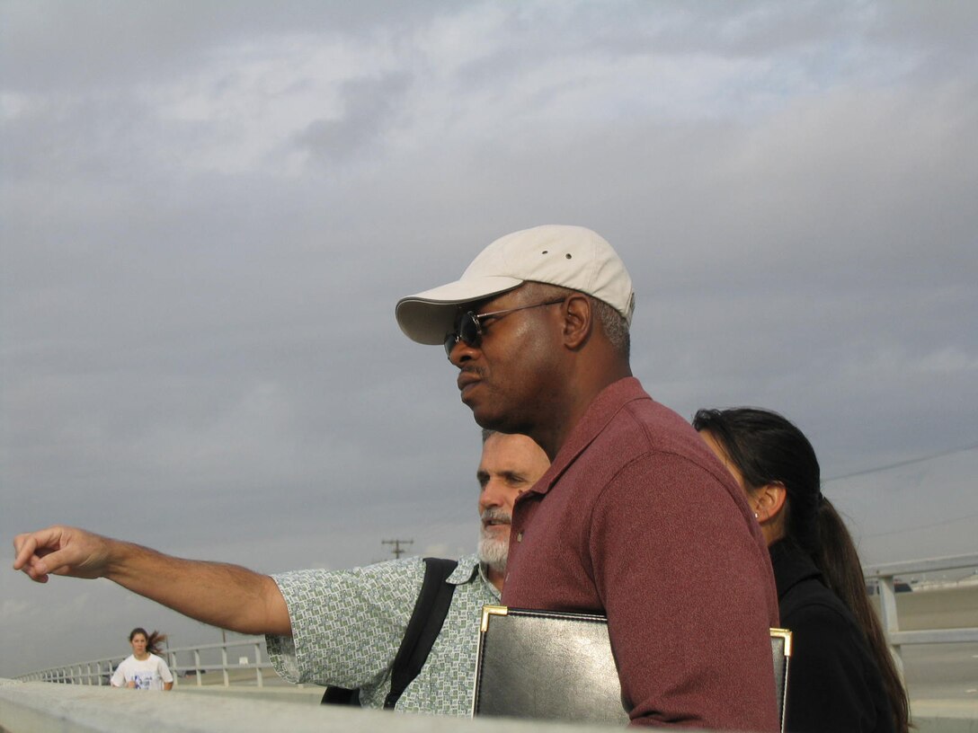 During a December 2004 visit, Ken Morris inspects sediment removal and protected habitat at the mouth of the Santa Ana River. 