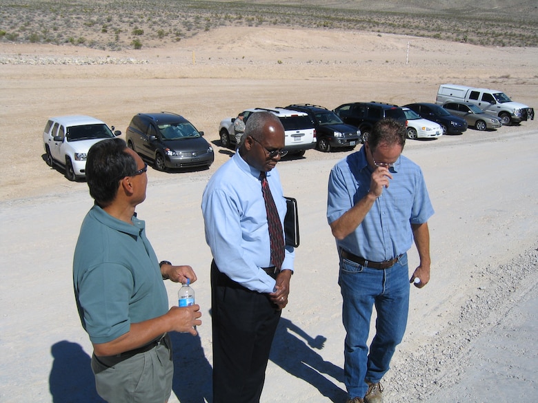 Ken Morris (center) discusses completion of the $336 million Tropicana-Flamingo phase of the Las Vegas, Nev., flood damage reduction project before a July 2007 ceremony. 
