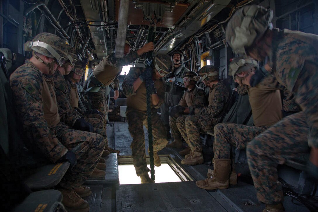 Marines execute fast-rope techniques out of a CH-53E Super Stallion helicopter Jan. 8 at a landing zone on Camp Hansen. “It’s important for the Marines to be comfortable with their gear when coming down (the rope),” said 
Sgt. Gregory J. Dominguez. “In hostile environments, they can’t be scared to come down from the helicopter. They have to be focused.” Dominguez is a machine gun section leader with 2nd Battalion, 5th Marine Regiment, currently assigned to the 31st Marine Expeditionary Unit, III Marine Expeditionary Force. The Marines are with 2nd Bn., 5th Marines, and the helicopter and crew are with Marine Heavy Helicopter Squadron 463, currently assigned to Marine Medium Tiltrotor Squadron 265 (Reinforced), 31st MEU. (U.S. Marine Corps photo by Cpl. Natalie M. Rostran/Released)