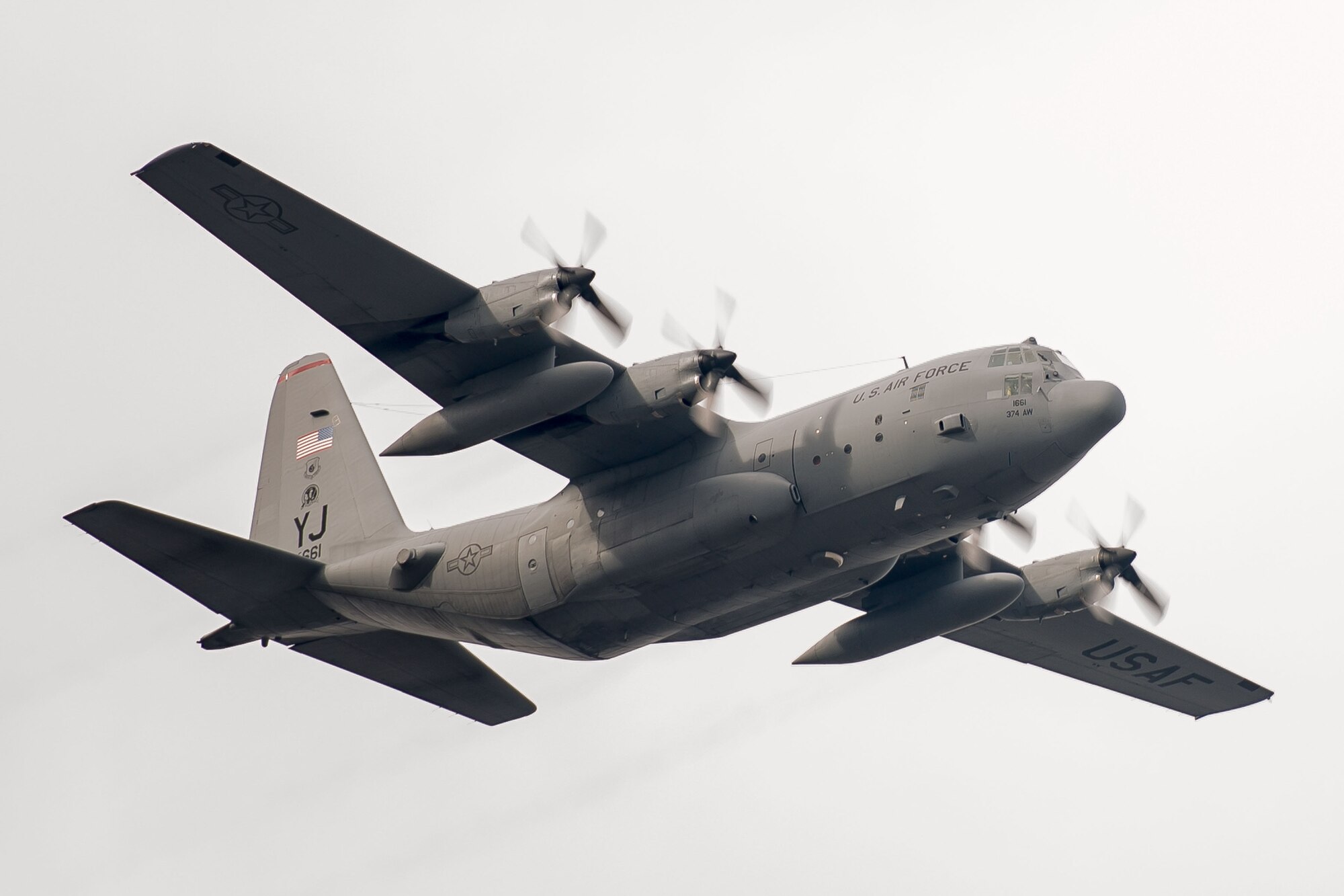 A C-130 Hercules with the 36th Airlift Squadron flies over Yokota Air Base, Japan, during a routine sortie Jan. 9, 2014. After completing missions in Bangladesh, Philippines and Guam, the 36 AS regularly conducts training missions to remain proficient in the necessary skills to support any contingency. (U.S. Air Force photo by Osakabe Yasuo)(RELEASED)