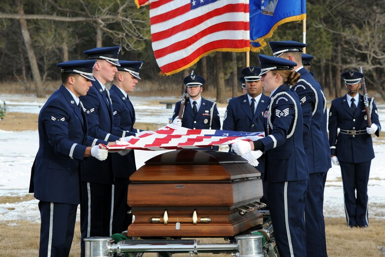 U.S. AIR FORCE ACADEMY, Colo. – Members of the High Frontier Honor Guard hold the flag that draped Capt. David Lyon’s casket during his interment ceremony at the United States Air Force Academy cemetery Jan. 8. Lyon, 21st Logistics Readiness Squadron, was killed in action Dec. 27 after the enemy attacked his convoy in Afghanistan. (U.S. Air Force photo/SSgt J. Aaron Breeden)