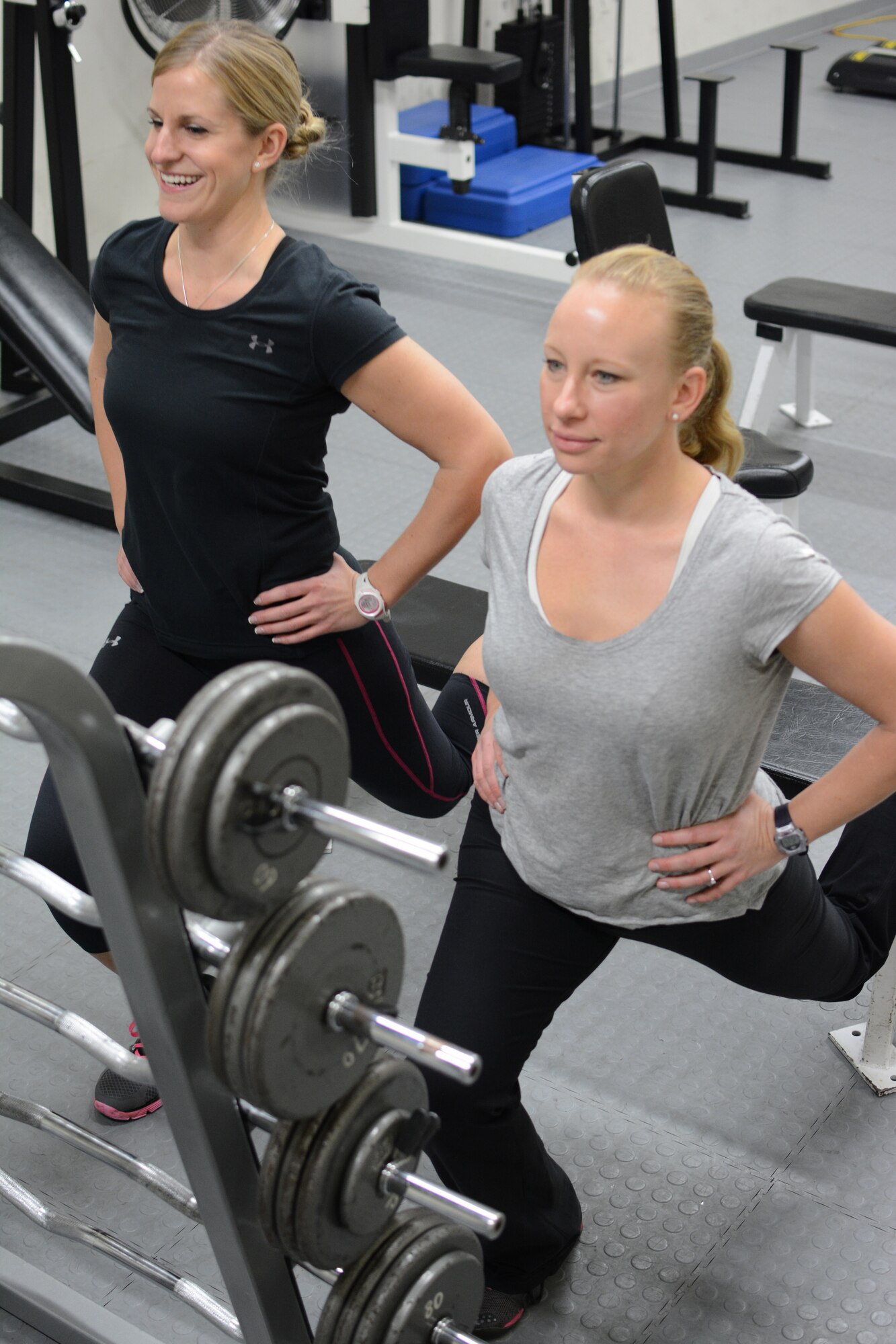 Tech. Sgt. Melanie McDonald, left, and 1st Lt. Angie Hellenbrand, members of the 115th Fighter Wing Fitness Working Group, work out together at the base gym on Truax Field in Madison, Wis., Jan. 9. As members of the fitness group, Airmen have the opportunity to participate in fitness classes and a running program. (Air National Guard photo by Senior Airman Andrea F. Liechti)