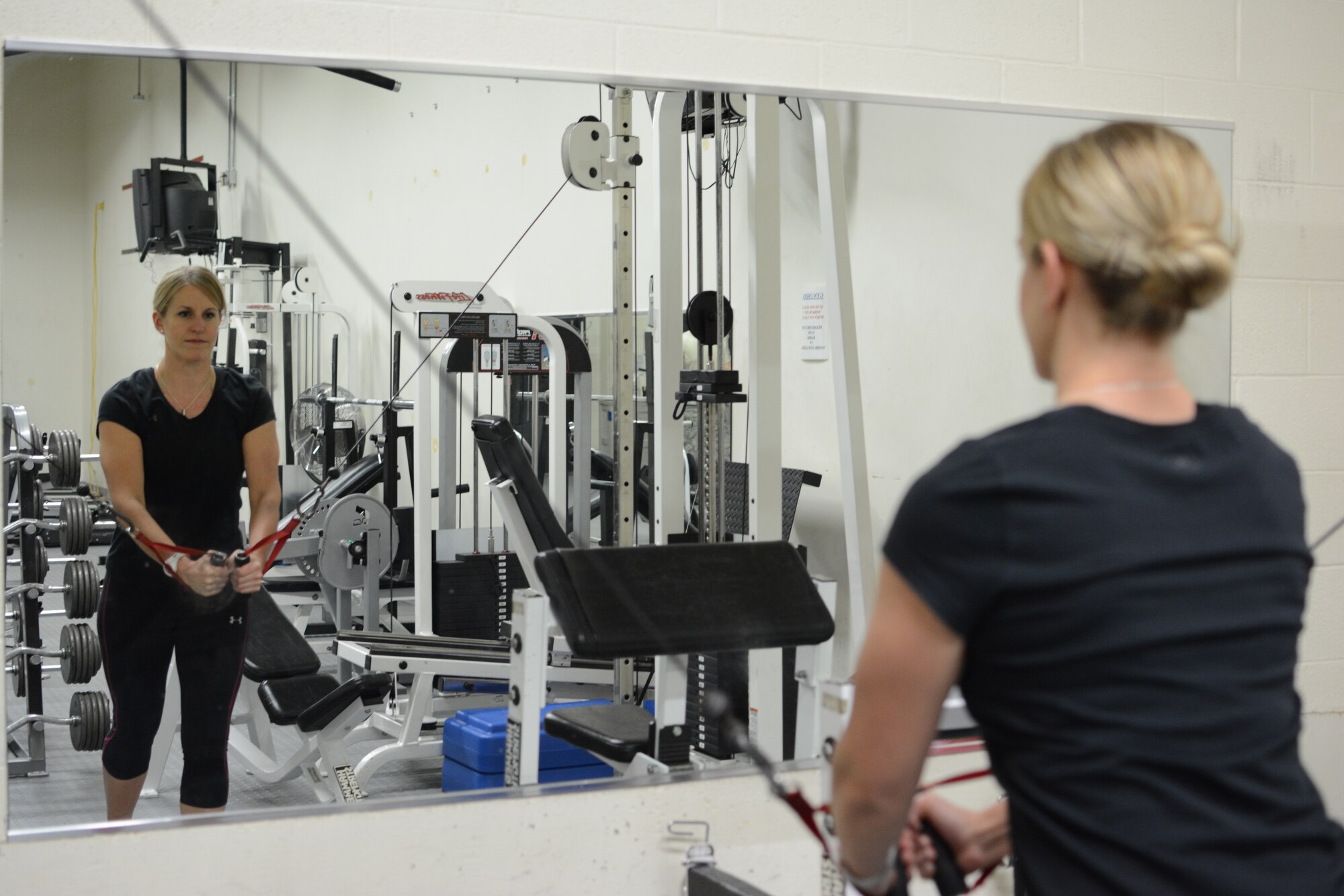 Tech. Sgt. Melanie McDonald, 115th Fighter Wing Fitness Working Group organizer and coach, works out at the base gym on Truax Field in Madison, Wis., Jan. 9. McDonald teamed up with two Airmen to develop the Fitness Working Group. They currently have more than 15 members and are implementing a running group and fitness classes for those who are interested. (Air National Guard photo by Senior Airman Andrea F. Liechti)