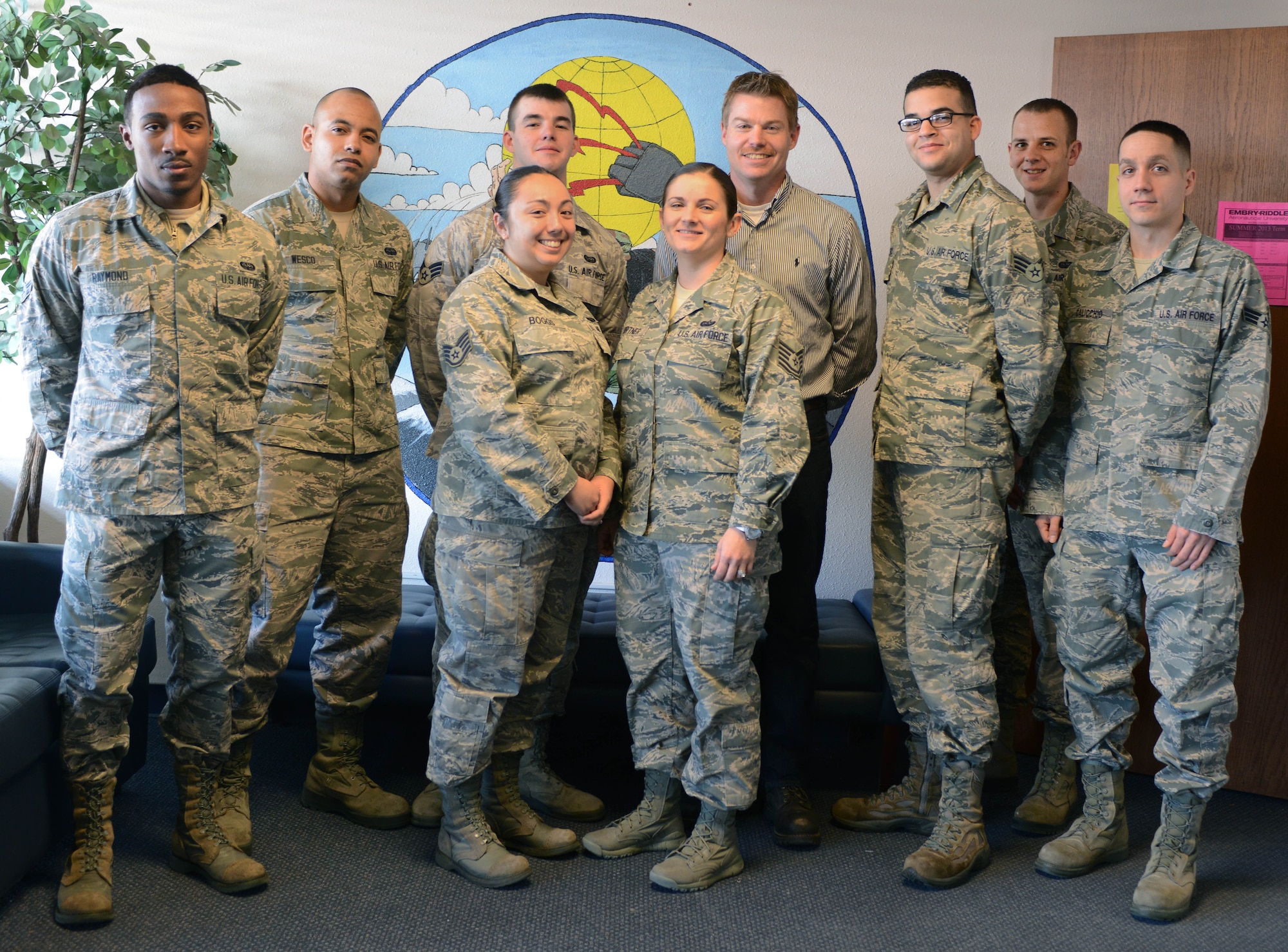 Members of the 366th Communications Squadron pose for a group photo, Jan. 9, 2014, at Mountain Home Air Force Base, Idaho. Maintaining responsibility for all telephones, BlackBerrys, land mobile radios, aircraft landing systems and classified network trouble calls, the CS is critical to the Air Force mission. (U.S. Air Force photo by Senior Airman Caitlin Guinazu/Released)  