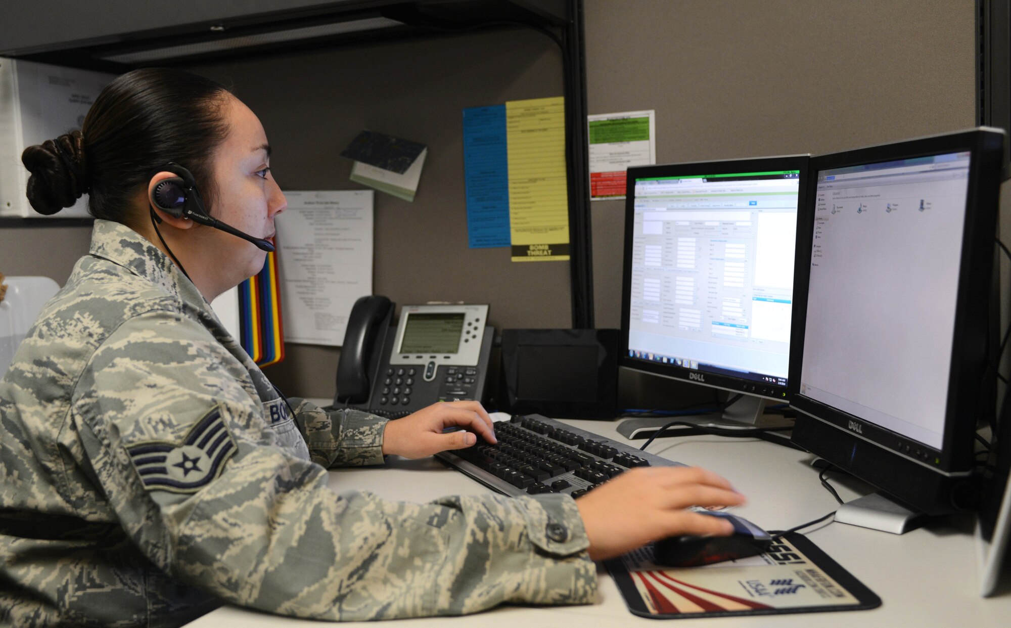 U.S. Air Force Staff Sgt. Vanessa Boggs, 366th Communications Squadron client systems technician, assists a customer over the phone, Jan. 9, 2014, at Mountain Home Air Force Base, Idaho. The 366th CS implemented a new satellite site process in order to provide the fastest level of service possible. (U.S. Air Force photo by Senior Airman Caitlin Guinazu/Released)