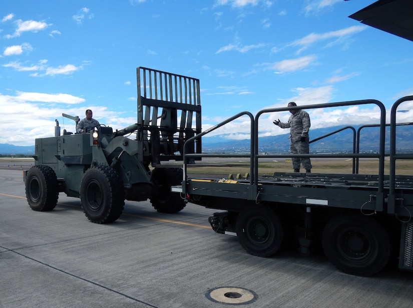 Members of Joint Task Force-Bravo's 612th Air Base Squadron offload, load, and refuel at C-130 Hercules aircraft at Soto Cano Air Base, Honduras, Jan. 8, 2014. The C-130 makes regular flights to Soto Cano to deliver supplies to the base, as well as to deliver items back to the United States. The 612 ABS provides a day and night, all-weather, C-5 capable airfield, base operations support, air traffic control, weather, crash and fire rescue, logistics and base civil engineers to support theater-wide USSOUTHCOM operations. (U.S. Air Force photos by Tech. Sgt. Stacy Rogers)
 