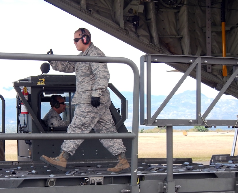 Members of Joint Task Force-Bravo's 612th Air Base Squadron offload, load, and refuel at C-130 Hercules aircraft at Soto Cano Air Base, Honduras, Jan. 8, 2014. The C-130 makes regular flights to Soto Cano to deliver supplies to the base, as well as to deliver items back to the United States. The 612 ABS provides a day and night, all-weather, C-5 capable airfield, base operations support, air traffic control, weather, crash and fire rescue, logistics and base civil engineers to support theater-wide USSOUTHCOM operations. (U.S. Air Force photos by Tech. Sgt. Stacy Rogers)
 