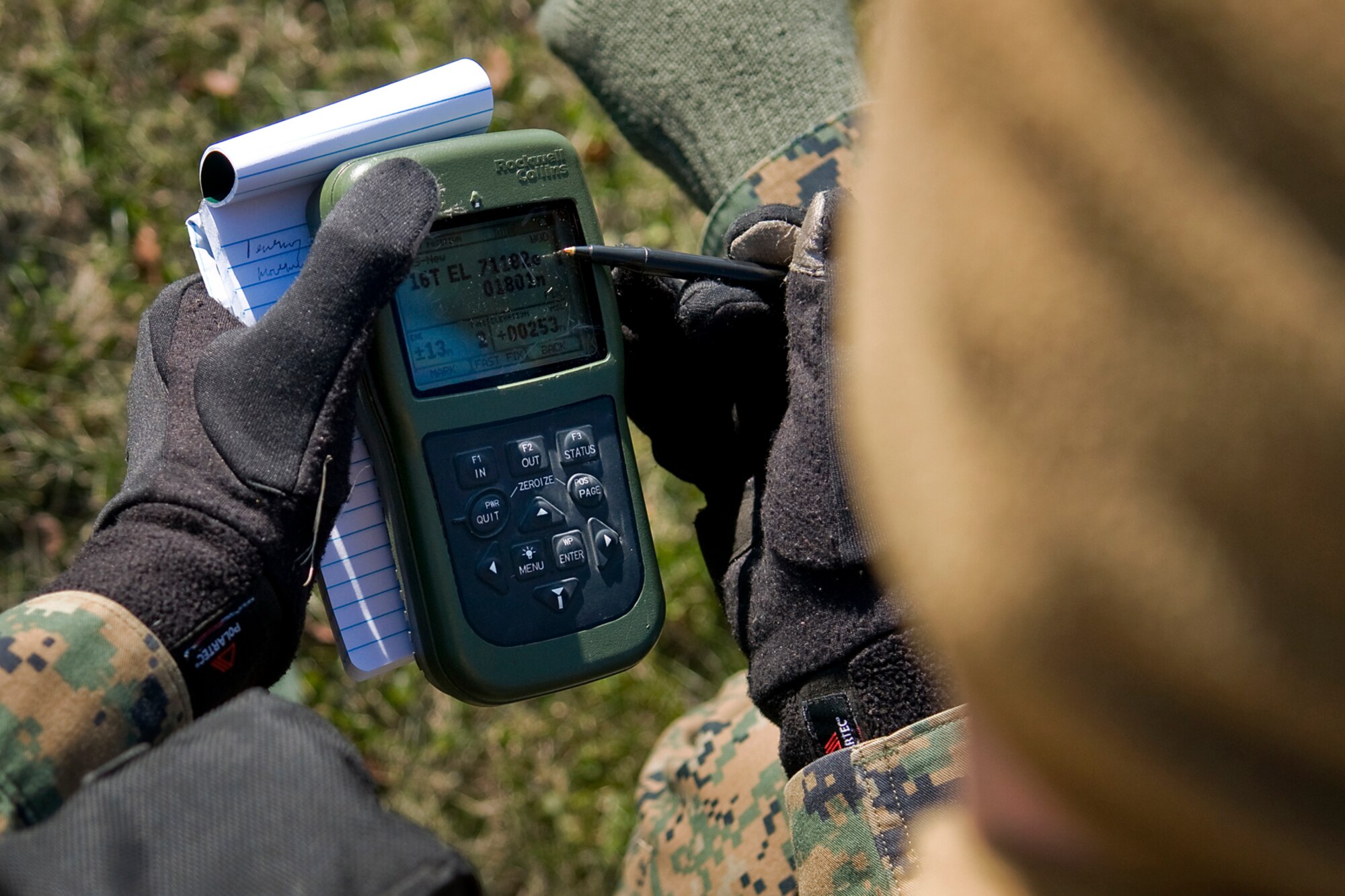 Cpl. Austin Bailey, a field radio operator with Detachment One, Communication Company, Combat Logistics Regiment 45, 4th Marine Logistics Group, checks his position using a global positioning satelited device during a communications exercise held at Grissom Air Reserve Base, Ind., Dec. 7. During the two-day exercise, Grissom Marines went on patrol around Grissom and trained on different communications scenarios they could encounter on the battlefield. (U.S. Air Force photo/Tech. Sgt. Mark R. W. Orders-Woempner) 
