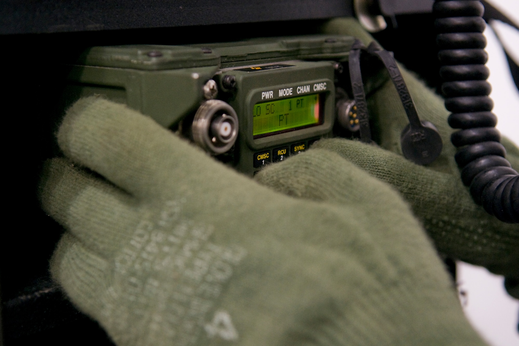 Lance Cpl. Brent Cohee, a field radio operator with Detachment One, Communication Company, Combat Logistics Regiment 45, 4th Marine Logistics Group, works on communications equipment during an exercise held at Grissom Air Reserve Base, Ind., Dec. 7. During the two-day exercise, Grissom Marines worked 24-hours-a-day to establish radio and data contact with fellow Marines in Greensboro, N.C. (U.S. Air Force photo/Tech. Sgt. Mark R. W. Orders-Woempner)
