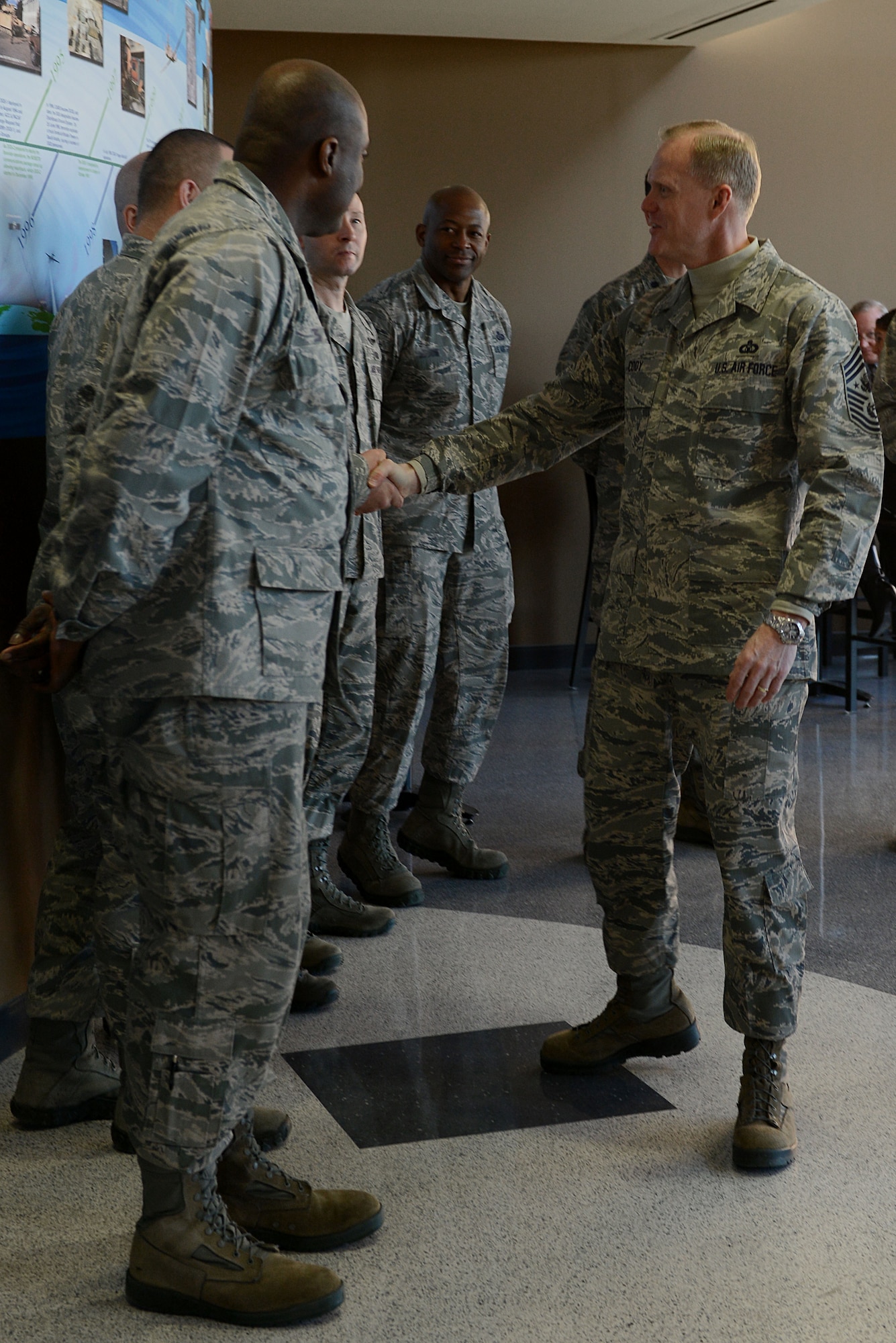 Chief Master Sgt. of the Air Force James A. Cody addresses members of the 497th Intelligence, Surveillance and Reconnaissance Group during a visit to Langley Air Force Base, Va., Jan. 7, 2014. Cody visited multiple wings and discussed force management issues, budget concerns and the future of the enlisted force with Airmen. (U.S. Air Force photo by Airman 1st Class Kimberly Nagle/Released)(Name-tags blurred for security purposes.)
