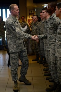 Chief Master Sgt. of the Air Force James A. Cody shakes the hands of Airmen of the 1st Operations Squadron during his tour of Langley Air Force Base, Va., Jan. 7, 2014. Cody visited multiple wings and discussed force management issues, budget concerns and the future of the enlisted force with Airmen. (U.S. Air Force photo/Airman 1st Class Areca T. Wilson/Released)