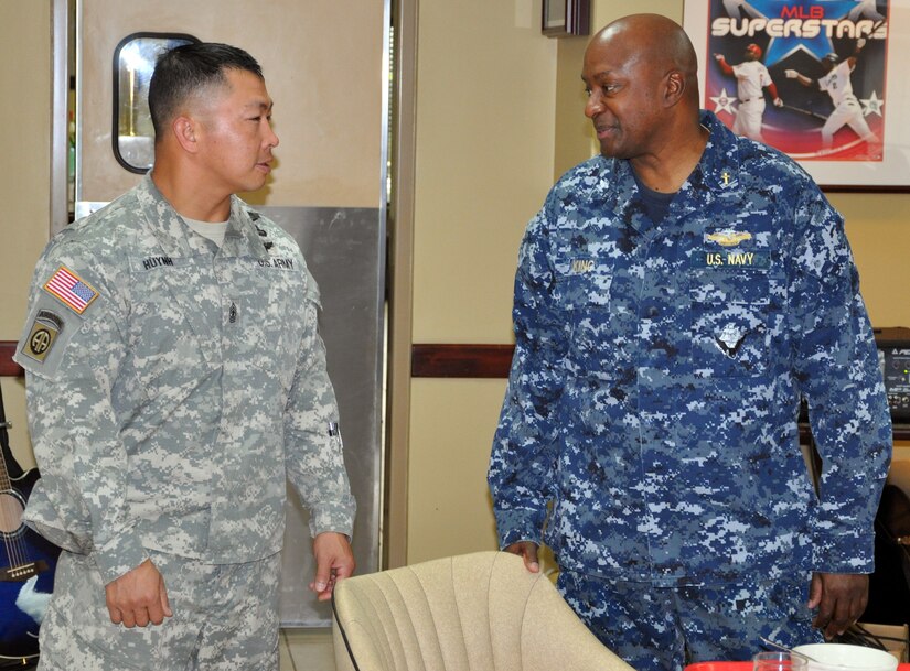 U.S. Army Sgt. Maj. Thinh Huynh visits with U.S. Navy Capt. Ronnie King, Command Chaplain, U.S. Southern Command, prior to King speaking at a "Prayer Breakfast" sponsored by the Joint Task Force-Bravo Chapel at Soto Cano Air Base, Honduras, Jan. 9, 2013.  As command chaplain, King is responsible for coordinating chaplain support to ensure the free exercise of religion for Army, Navy, Air Force, Marine and Coast Guard service members, their family members and other U.S. personnel within the SOUTHCOM area of responsibility. (U.S. Air Force photo by Capt. Zach Anderson)