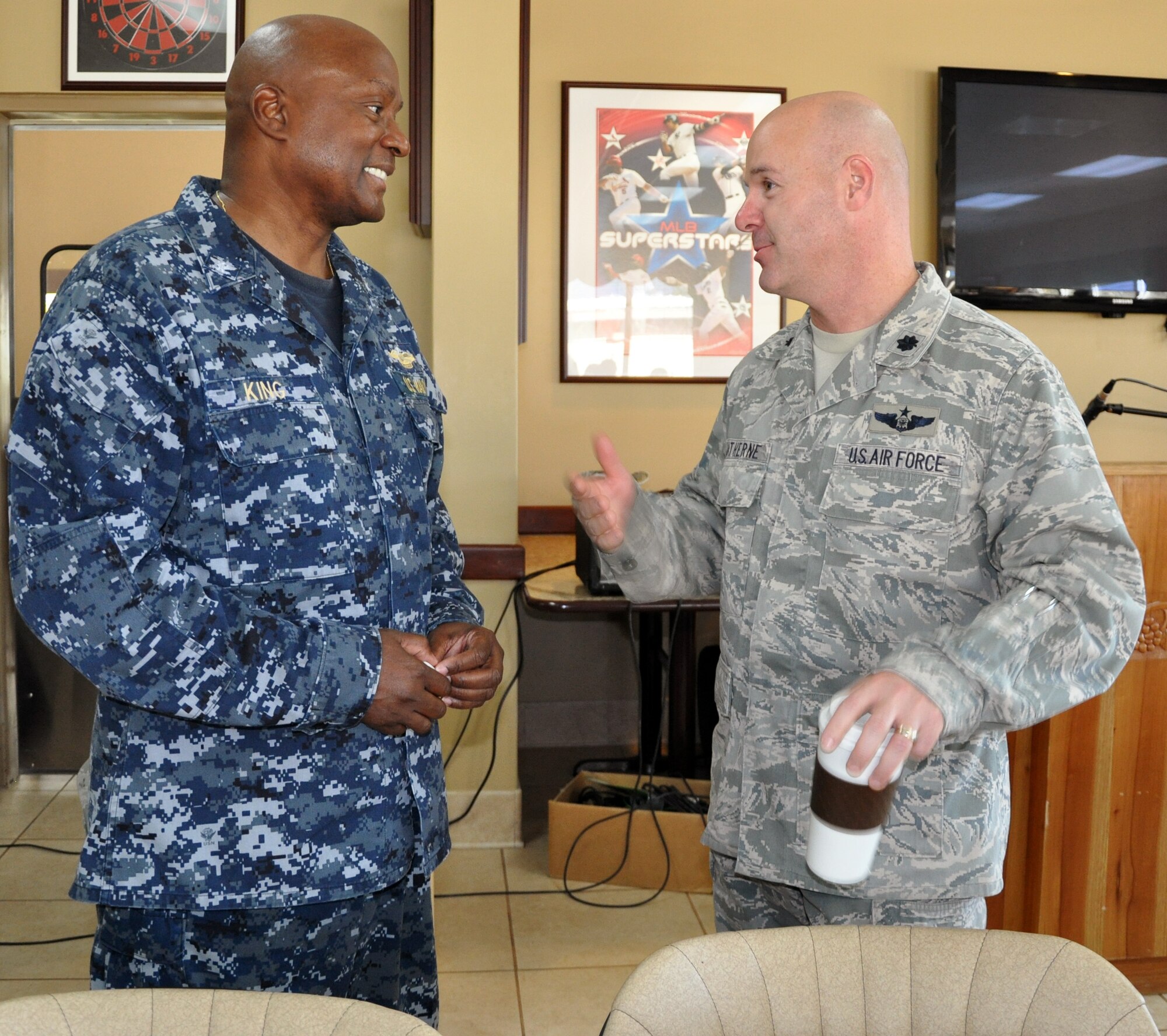 U.S. Navy Capt. Ronnie King, Command Chaplain, U.S. Southern Command, visits with U.S. Air Force Lt. Col. Ray Matherne, Commander, 612th Air Base Squadron, prior to King speaking at a "Prayer Breakfast" sponsored by the Joint Task Force-Bravo Chapel at Soto Cano Air Base, Honduras, Jan. 9, 2013.  As command chaplain, King is responsible for coordinating chaplain support to ensure the free exercise of religion for Army, Navy, Air Force, Marine and Coast Guard service members, their family members and other U.S. personnel within the SOUTHCOM area of responsibility. (U.S. Air Force photo by Capt. Zach Anderson)