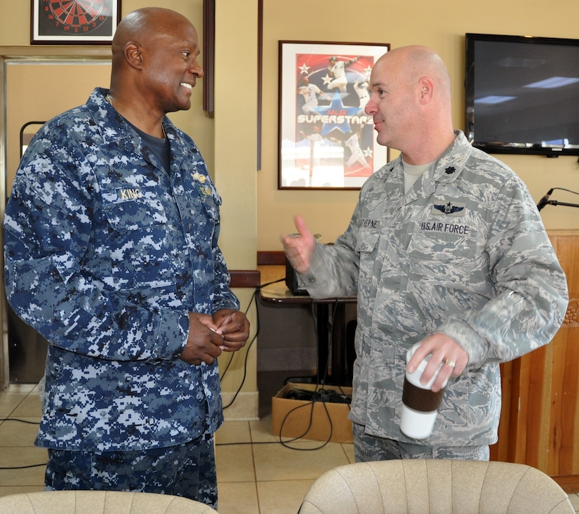 U.S. Navy Capt. Ronnie King, Command Chaplain, U.S. Southern Command, visits with U.S. Air Force Lt. Col. Ray Matherne, Commander, 612th Air Base Squadron, prior to King speaking at a "Prayer Breakfast" sponsored by the Joint Task Force-Bravo Chapel at Soto Cano Air Base, Honduras, Jan. 9, 2013.  As command chaplain, King is responsible for coordinating chaplain support to ensure the free exercise of religion for Army, Navy, Air Force, Marine and Coast Guard service members, their family members and other U.S. personnel within the SOUTHCOM area of responsibility. (U.S. Air Force photo by Capt. Zach Anderson)