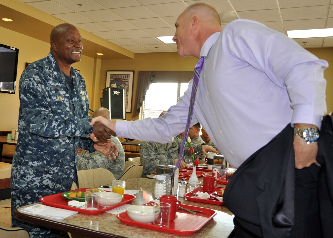 U.S. Army Col. Thomas Boccardi, Commander, Joint Task Force-Bravo, greets U.S. Navy Capt. Ronnie King, Command Chaplain, U.S. Southern Command, prior to King speaking at a "Prayer Breakfast" sponsored by the Joint Task Force-Bravo Chapel at Soto Cano Air Base, Honduras, Jan. 9, 2013.  As command chaplain, King is responsible for coordinating chaplain support to ensure the free exercise of religion for Army, Navy, Air Force, Marine and Coast Guard service members, their family members and other U.S. personnel within the SOUTHCOM area of responsibility. (U.S. Air Force photo by Capt. Zach Anderson)