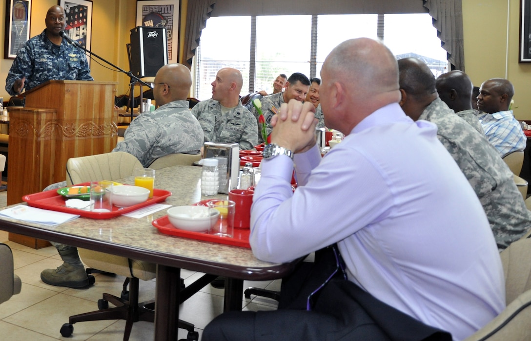 U.S. Navy Capt. Ronnie King, Command Chaplain, U.S. Southern Command, visited with members of Joint Task Force-Bravo during a "Prayer Breakfast" sponsored by the Joint Task Force-Bravo Chapel, Jan. 9, 2013. As command chaplain, King is responsible for coordinating chaplain support to ensure the free exercise of religion for Army, Navy, Air Force, Marine and Coast Guard service members, their family members and other U.S. personnel within the SOUTHCOM area of responsibility. (U.S. Air Force photo by Capt. Zach Anderson)
 