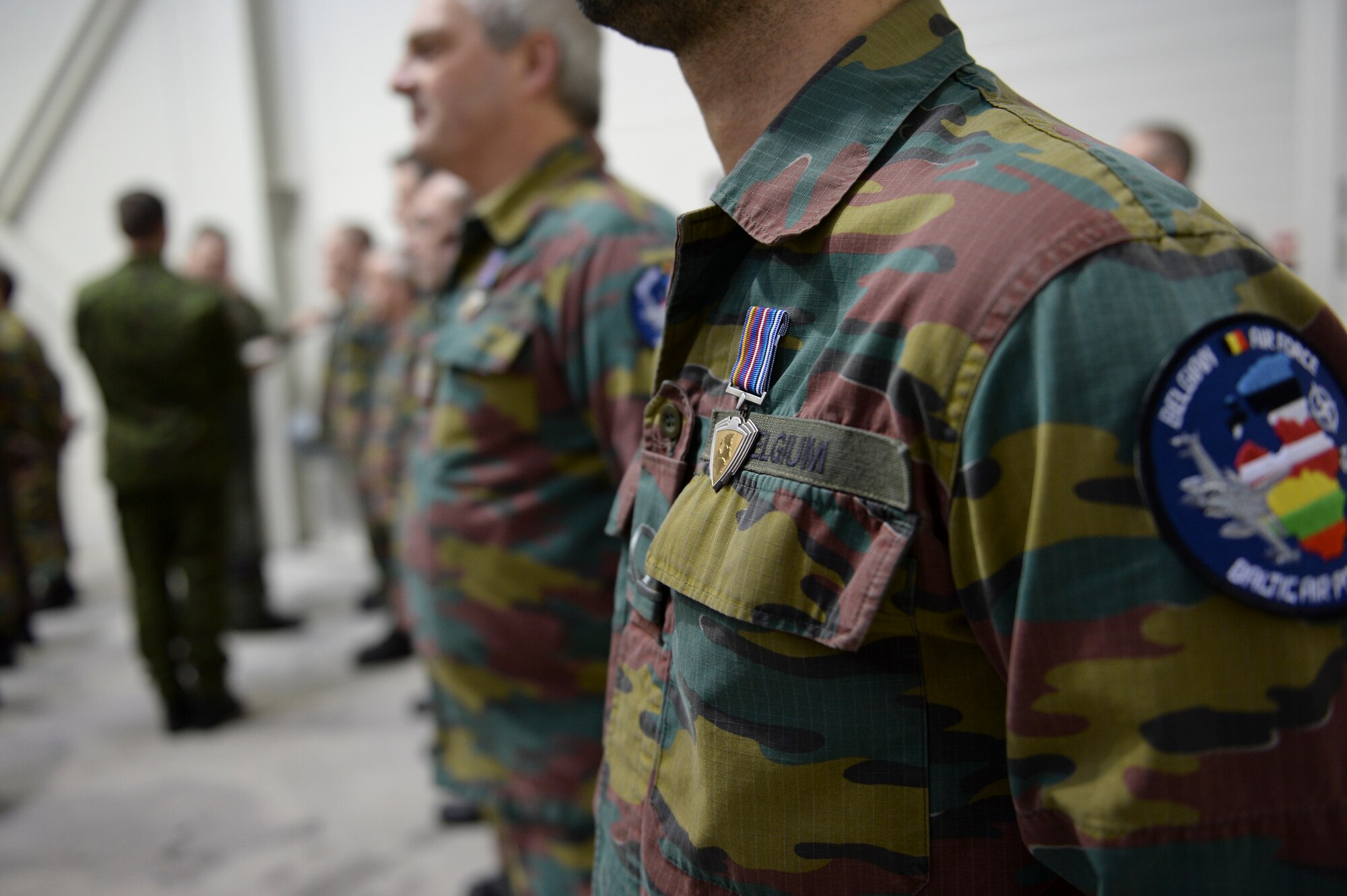 Belgian air force members are rewarded the Common award for their participation in the Baltic Air Policing mission during a Change of Command ceremony at Šiauliai Air Base, Lithuania, Jan. 3, 2014. The ceremony acknowledged the transfer of the BAP mission from the Belgian air force to the U.S. Air Force. The U.S. will maintain Lithuania’s sovereign air space for a period of four months. (U.S. Air Force photo by Airman 1st Class Nigel Sandridge/Released)