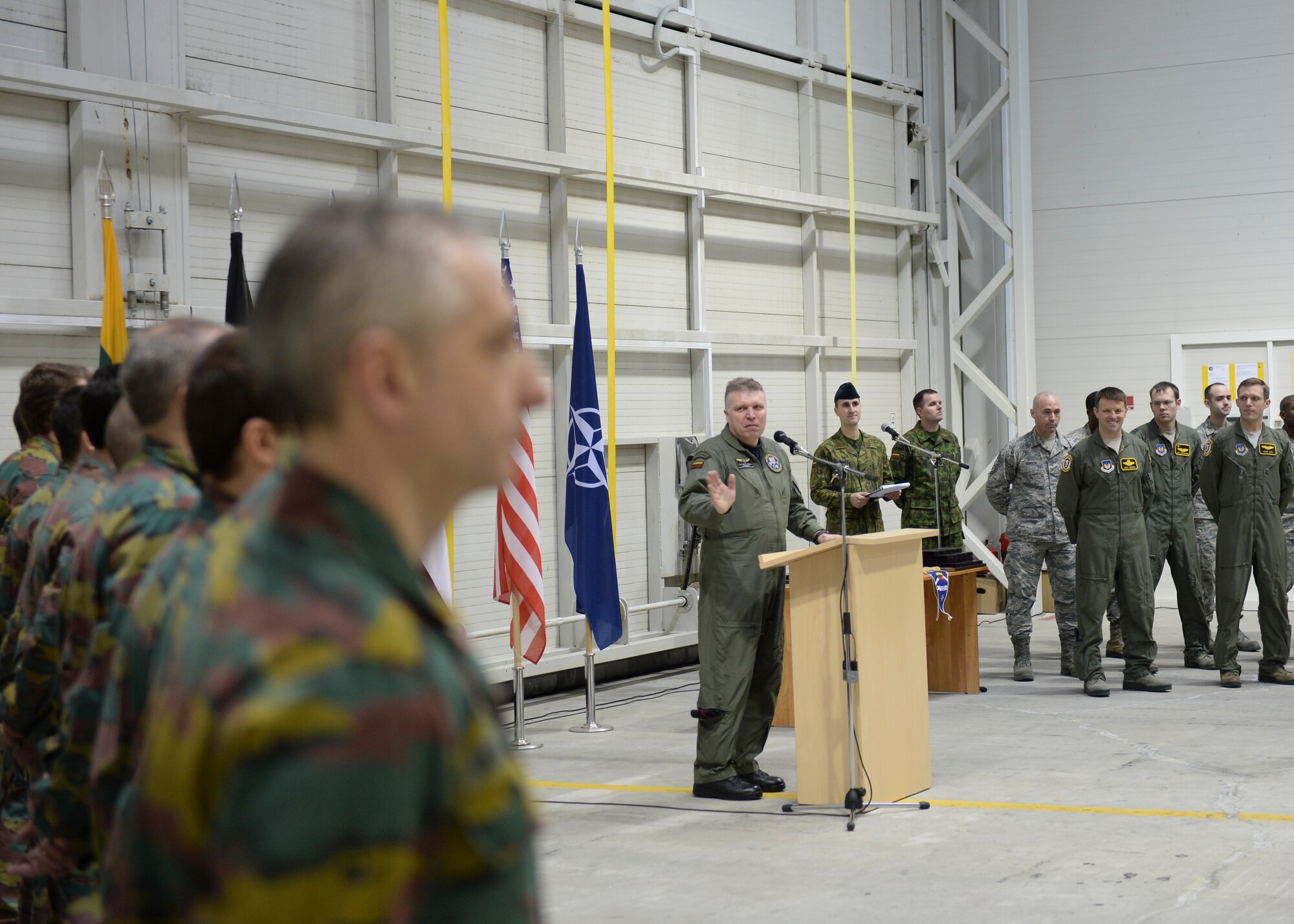 Maj Gen Edvardas Mažeikis, commander of the Lithuanian Air Force, expresses thanks to the Belgian and U.S. air forces during a change of command Jan. 3, 2014. The ceremony acknowledged the transfer of the Baltic Air Policing mission from the Belgian air force to the U.S. Air Force. The U.S. will maintain Lithuania’s sovereign air space for four months. (U.S. Air Force photo by Airman 1st Class Nigel Sandridge/Released)