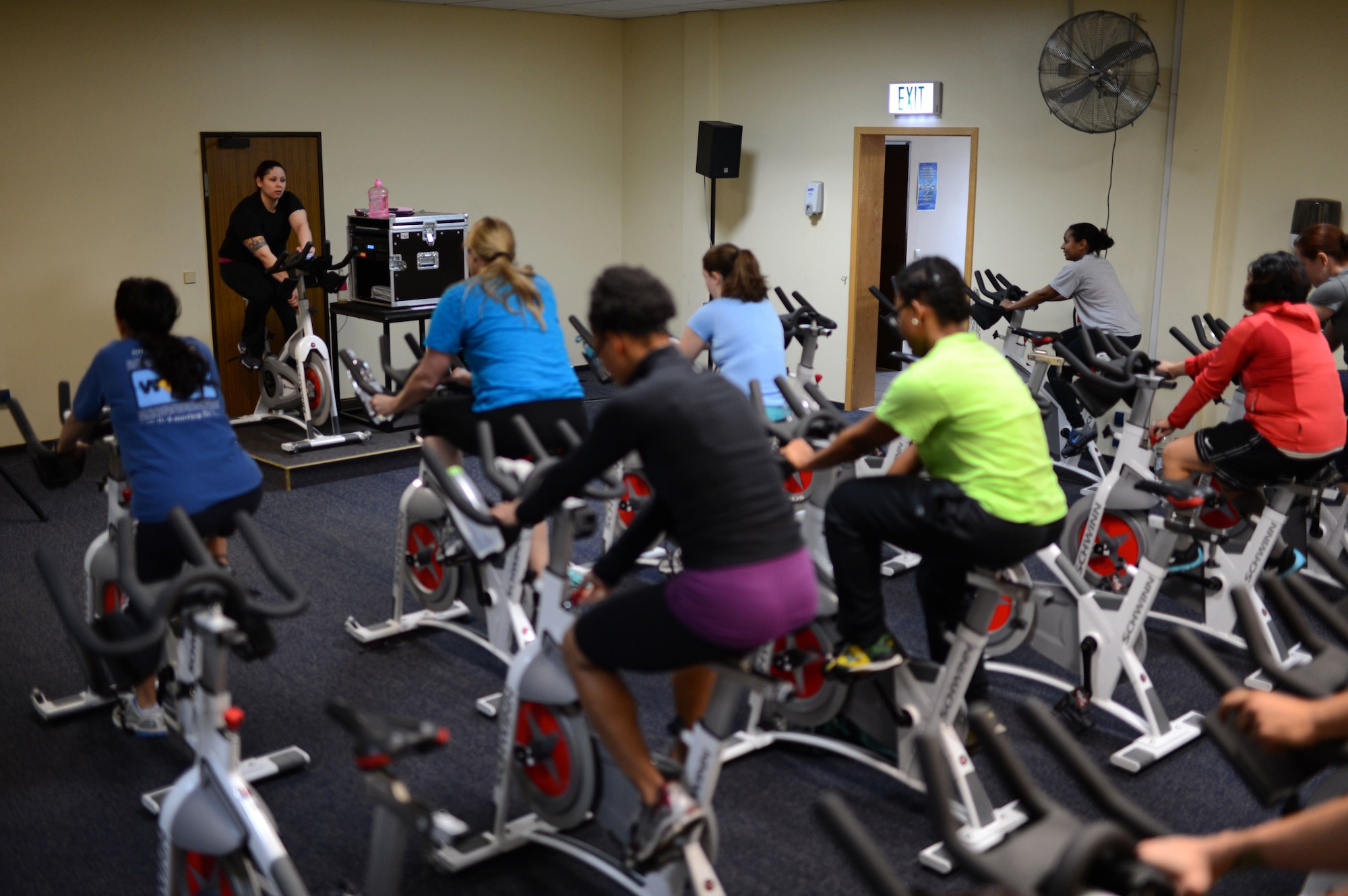SPANGDAHLEM AIR BASE, Germany – Airmen and families participate in a spin class inside the Skelton Memorial Fitness Center Jan. 7, 2014. Spin classes will cease in the Skelton Memorial Fitness Center Jan. 9, 2014, due to the transition to the newly constructed fitness center. (U.S. Air Force photo by Senior Airman Gustavo Castillo/Released)