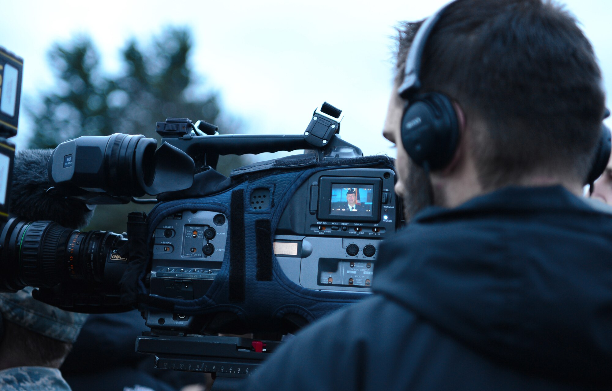 Media crews film Col. Kyle Robinson, 48th Fighter Wing commander, during a press conference Jan. 9, 2014 at Royal Air Force Lakenheath, England. The press conference was held to address the tragedy of the HH-60 Pave Hawk helicopter crash, Tuesday, Jan. 7, 2014. (U.S. Air Force photo by Airman 1st Class Dawn M. Weber)