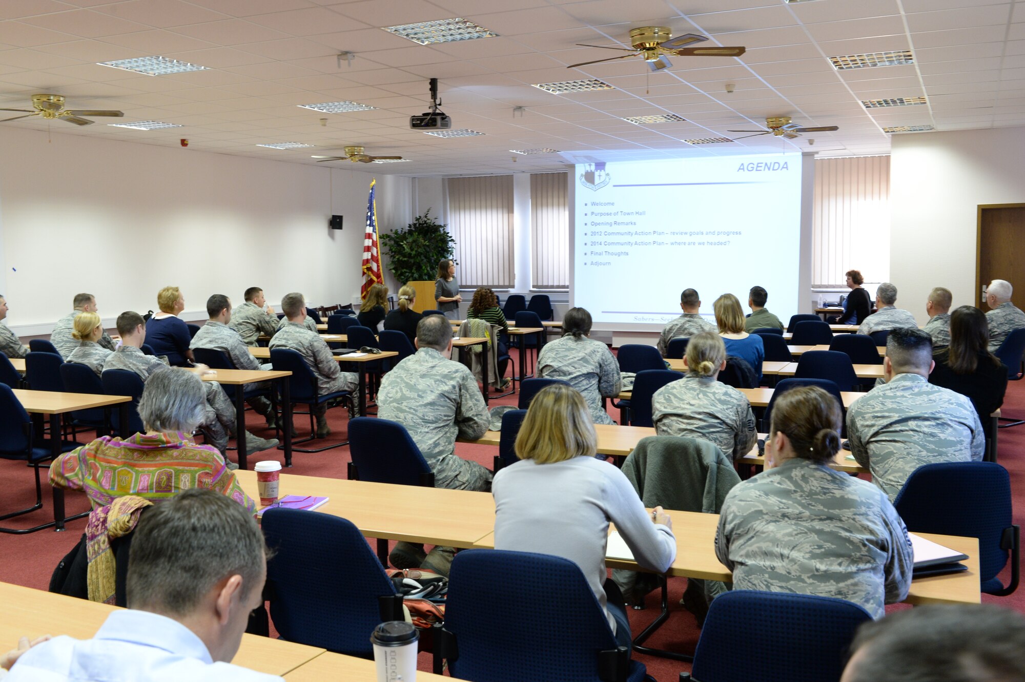 SPANGDAHLEM AIR BASE, Germany -- More than 40 Airmen and their families view a presentation during a town hall session at the Viper Conference Room Jan. 8, 2014. Lee McDonough, community support coordinator for Spangdahlem, organized the event to augment support for the upcoming 2014 Caring for People forum. (U.S. Air Force photo by Staff Sgt. Joe W. McFadden / Released) 