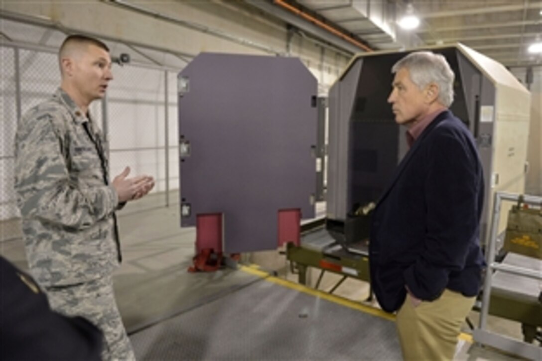 Defense Secretary Chuck Hagel receives a brief by Air Force Maj. Andrew Hackleman of the 898th Munitions Squadron as he tours an underground munitions storage facility at Sandia National Laboratories in Albuquerque, N.M., Jan. 8, 2014. 