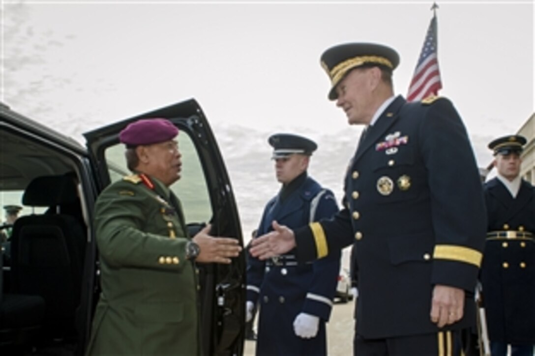 U.S. Army Gen. Martin E. Dempsey, chairman of the Joint Chiefs of Staff, greets Malaysian Gen. Tan Sri Dato’ Sri Zulkifeli, chief of Malaysia's defense forces, outside the Pentagon, Jan. 9, 2014. The two defense chiefs met to discuss issues of mutual importance.