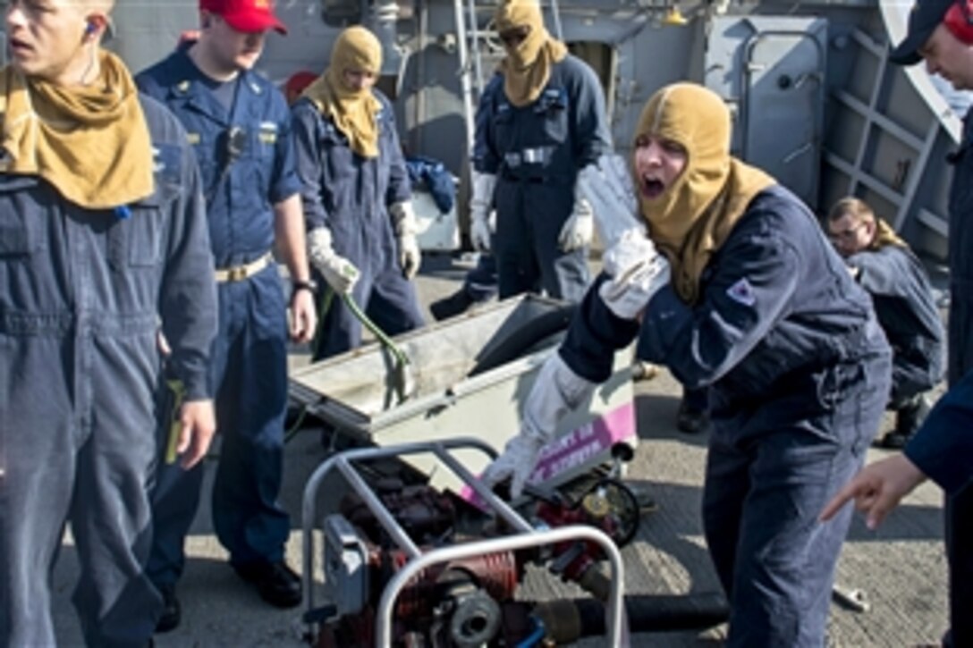 U.S. sailors operate pump during a damage control team exercise aboard the guided-missile destroyer USS Stout in the U.S. 6th Fleet area of responsibility, Jan. 7, 2014. The Stout is supporting maritime security operations and theater security cooperation efforts.