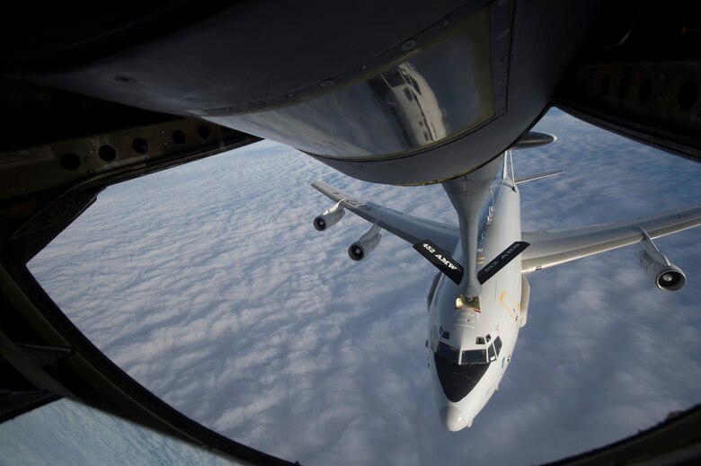 A U.S. Air Force KC-135 Stratotanker from the 340th Expeditionary Air Refueling Squadron, Al Udied Air Base, Qatar, refuels a North Atlantic Treaty Organization E-3 Sentry Jan. 7, 2014, over Northeast, Afghanistan. The crew of the Stratotanker provided fuel for coalition aircraft during their over ten hour combat sortie. (U.S. Air Force photo by Tech. Sgt. Jason Robertson/Released)