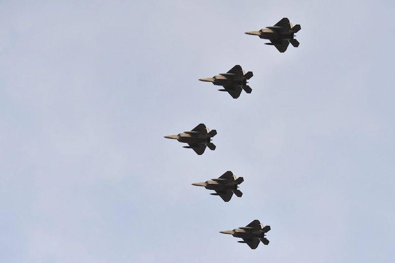 Five F-22 Raptors fly in formation over Tyndall Air Force Base during an event held in their honor Jan. 6. These jets mark the beginning of a new mission at Tyndall and are the first five of 24 marked to call Tyndall their new home. (U.S. Air Force photo by Airman 1st Class Dustin Mullen)