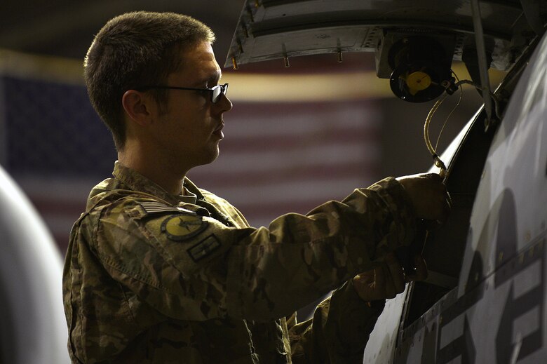 U.S. Air Force Senior Airman Anthony Green, 455th Expeditionary Maintenance Squadron electrical environmental journeyman, tests the panel fan on an A-10 Thunderbolt II at Bagram Airfield, Afghanistan, Dec. 30, 2013. The A-10 Thunderbolt II provides close-air support for troops on the ground. Green is deployed from the 23rd Component Maintenance Squadron at Moody Air Force Base, Ga., and is a native of San Diego, Calif. (U.S. Air Force photo by Senior Airman Kayla Newman/Released)