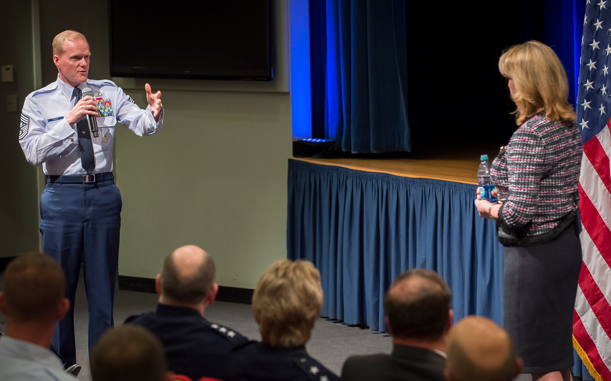 Secretary of the Air Force Deborah Lee James listens to a question from Chief Master Sgt. of the Air Force James Cody during her first town hall meeting Jan. 9, 2014, in the Pentagon auditorium, Washington, D.C. During her address, James gave insight into her life and shared career advice with Airmen across the Air Force. (U.S. Air Force photo/Jim Varhegyi)