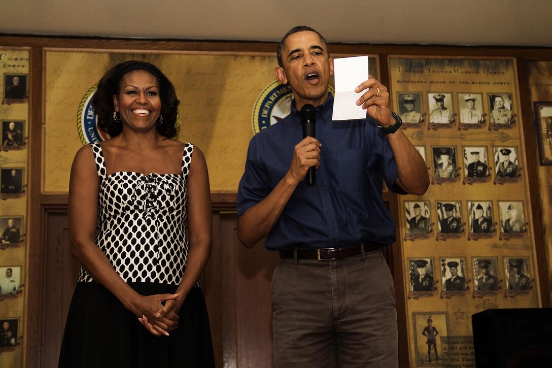 President Barack Obama and first lady Michelle Obama speaks active duty service members on Christmas Day during a visit to the Anderson Hall Dining Facility aboard Marine Corps Base Hawaii, Dec. 25, 2013. The president recognized each unit aboard the base and thanked them with their service. After his speech, the president and first lady posed for photographs with service members. (U.S. Marine Corps photo by Lance Cpl. Matthew Bragg)