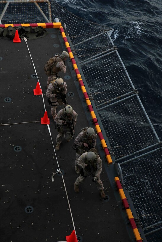 U.S. Marines assigned to Reconnaissance Platoon, Battalion Landing Team 1/4, 13th Marine Expeditionary Unit (MEU) conduct live fire training aboard the USS Boxer (LHD 4) at sea Jan. 8, 2014. The 13th MEU is deployed with the Boxer Amphibious Ready Group as a theater reserve and crisis response force throughout the U.S. 5th Fleet area of responsibility. (U.S. Marine Corps photo by Cpl. David Gonzalez, 13th Marine Expeditionary Unit Combat Camera/Released)
